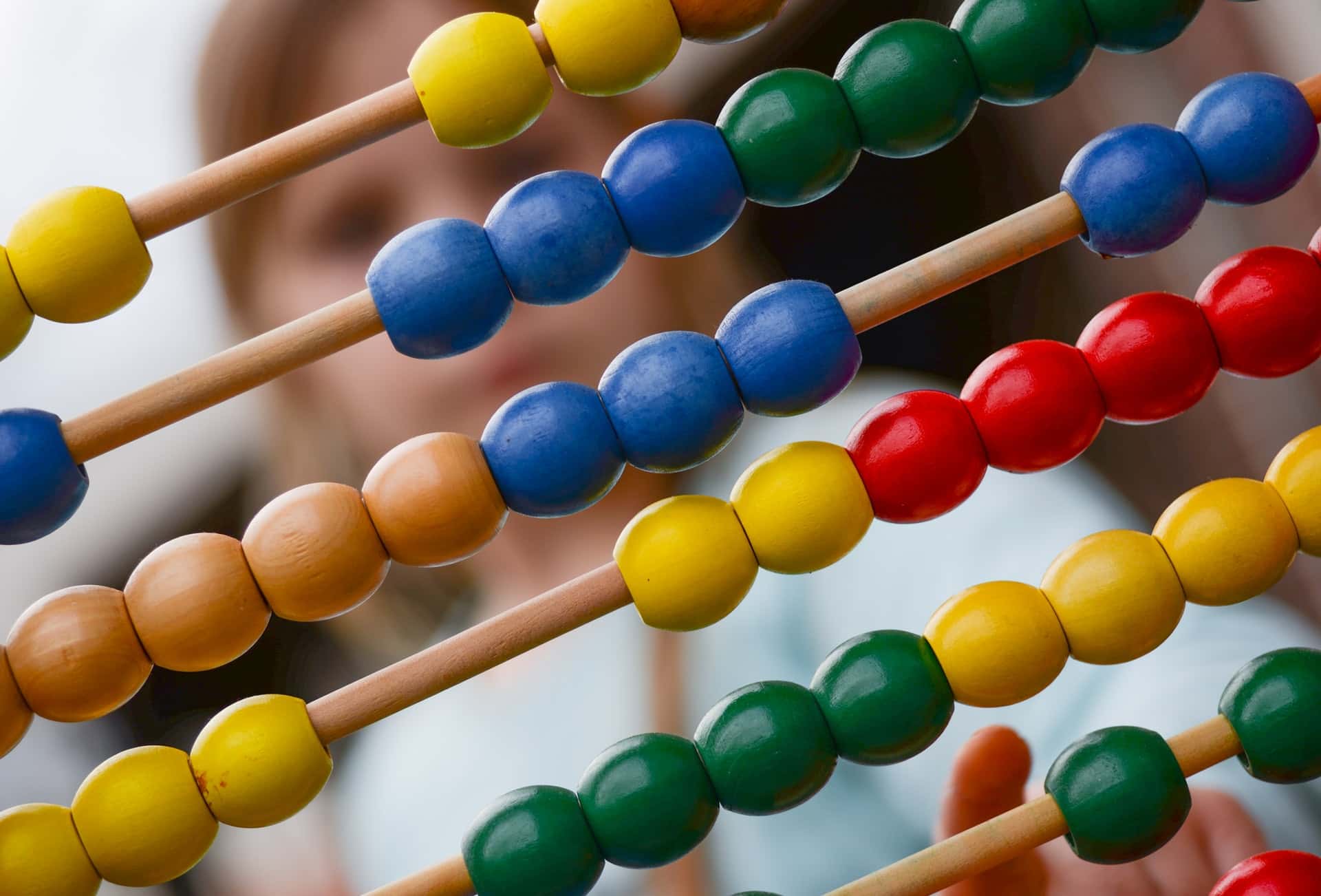 A person using a colorful abacus